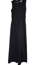Enterizo color negro, talla 6, con aberturas en las piernas