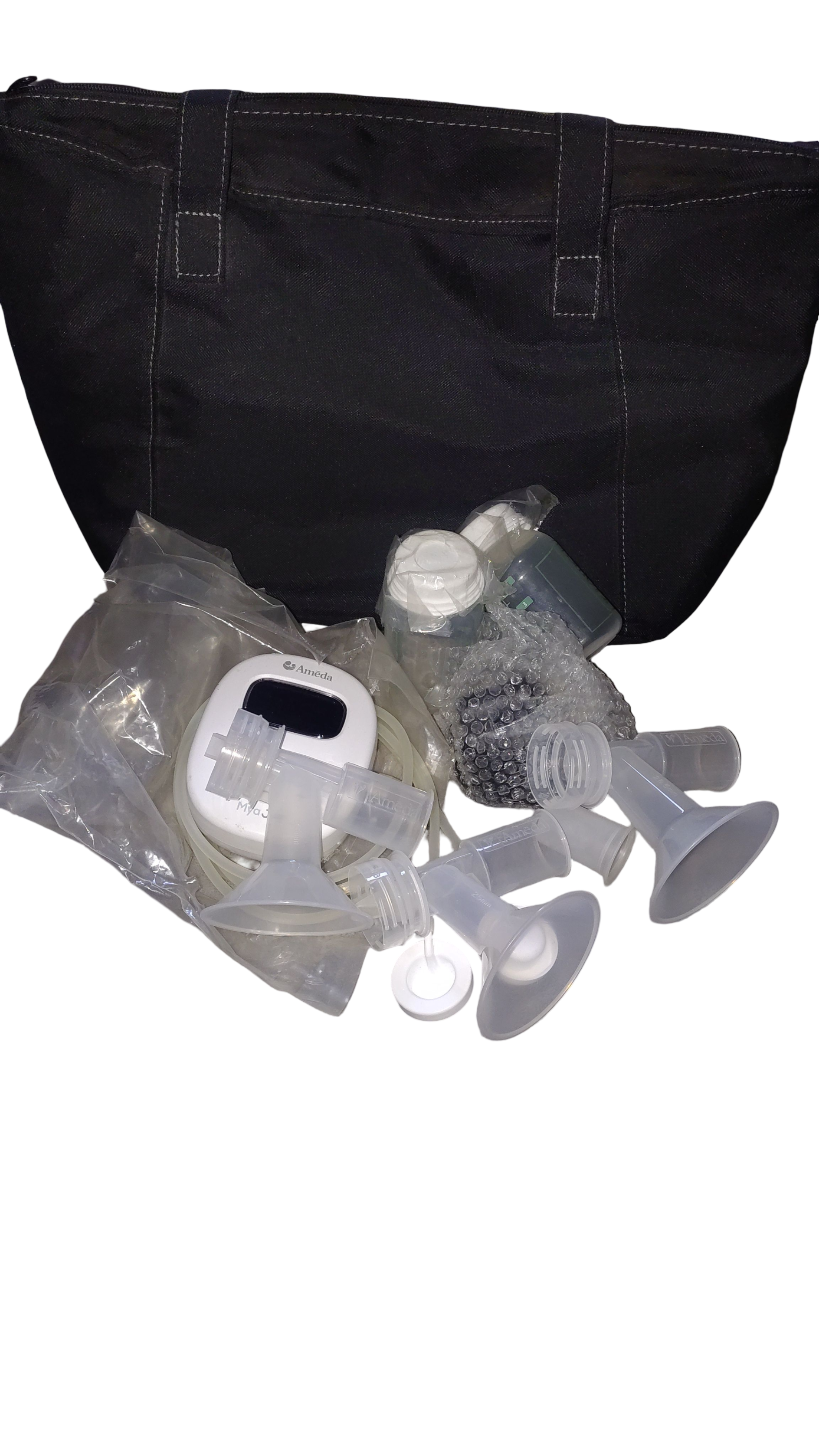 Extractor de leche materna, marca Ameda, incluye bolsa y brasier para la extracción